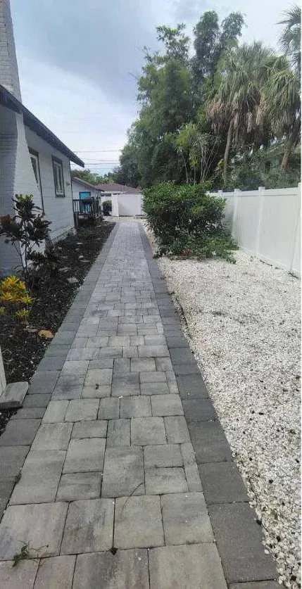 After: Paver walkway & rock bed rescue