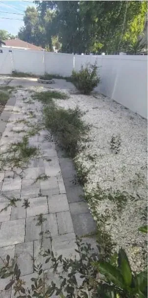 Before: Side-yard rock & paver weeding